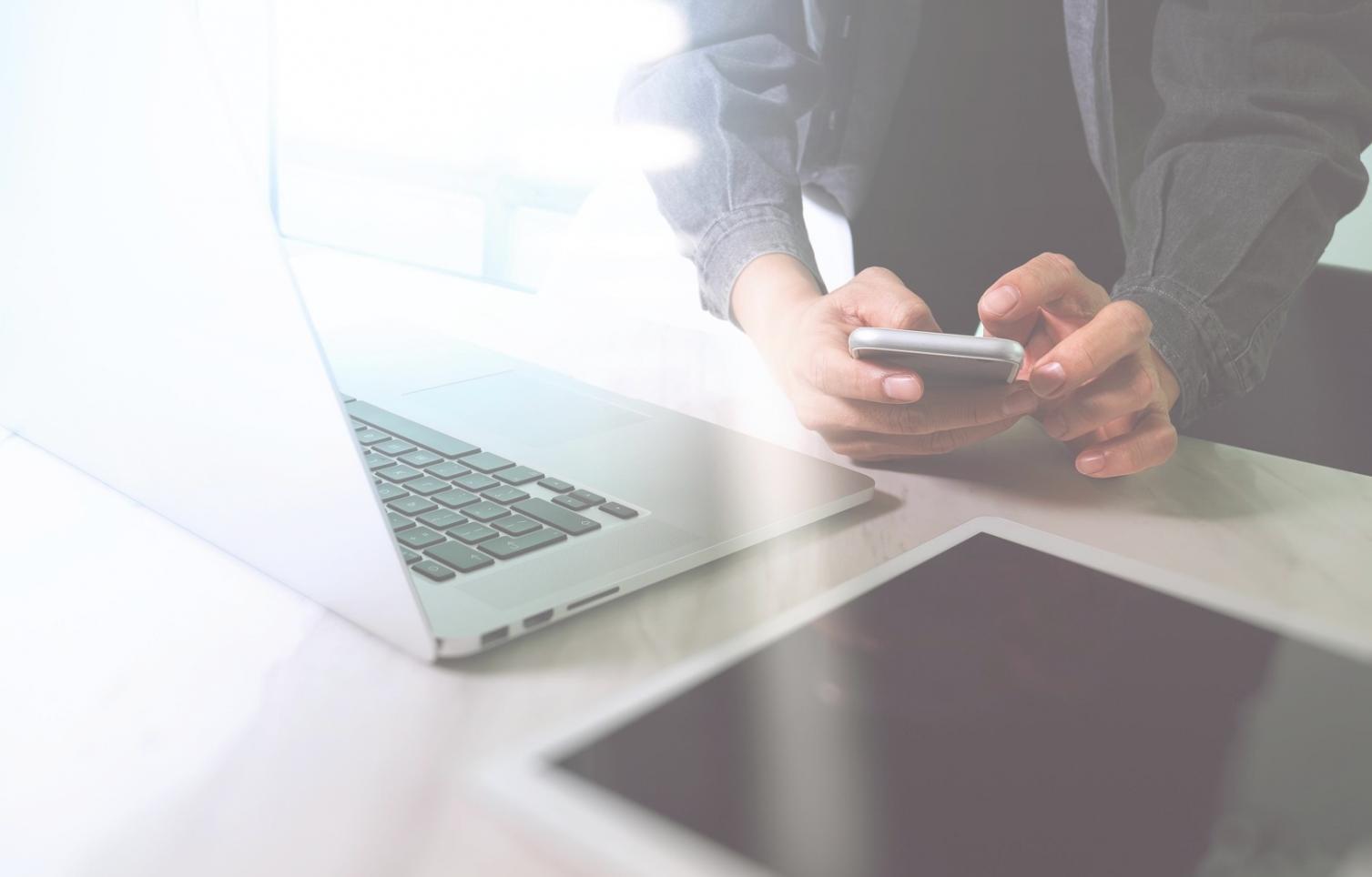 Students learning game development programming on computers in classroom setting